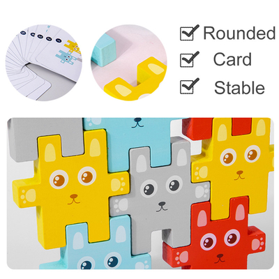 ブロックのおもちゃのウサギのJengaのバランスをとるゲームを積み重ねている子供のMontessori動物