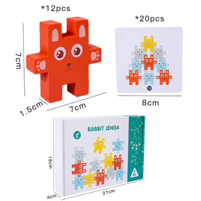 ブロックのおもちゃのウサギのJengaのバランスをとるゲームを積み重ねている子供のMontessori動物