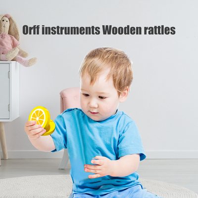 教育Montessoriをつかんでいる子供の赤ん坊のための木の音楽的なおもちゃ
