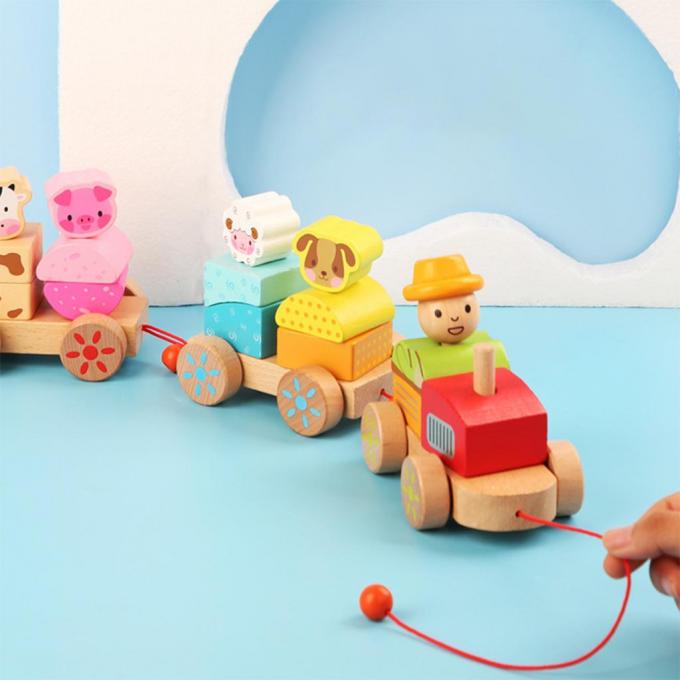 木製の列車のトラックは就学前の幼児の子供のためのDIYの教育おもちゃを形づける