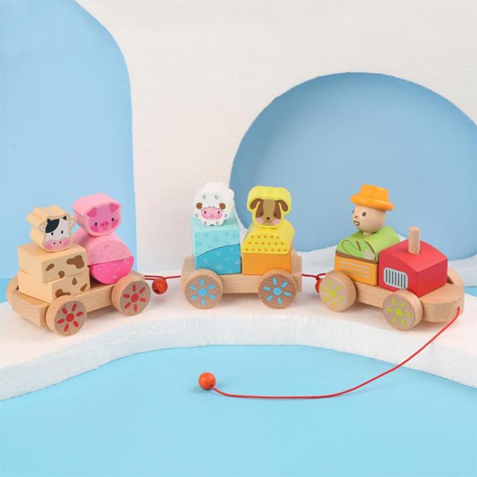 木製の列車のトラックは就学前の幼児の子供のためのDIYの教育おもちゃを形づける